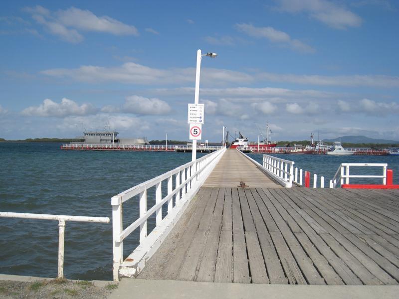 Port Welshpool - Port Welshpool Wharf and surrounding foreshore, Lewis Street near eastern end: View south along jetty at wharf