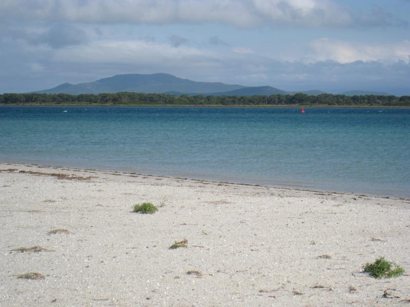 Port Welshpool - Foreshore and beach along southern side of Lewis Street: View south from beach near Dobson St towards Little Snake Island and mountains of Wilsons Promontory
