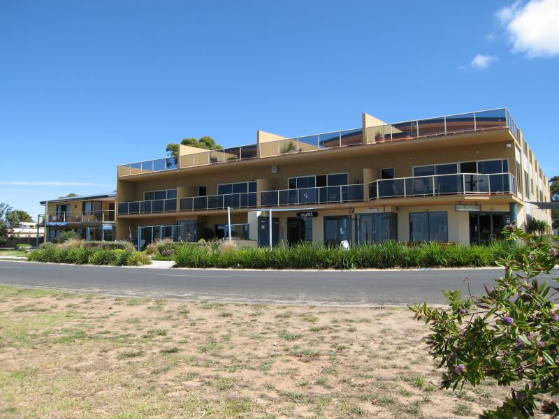 Rhyll - Shops and coast along Beach Road between Reid Street and boat ramp: Shops and apartments, corner Beach Rd and Lock Rd