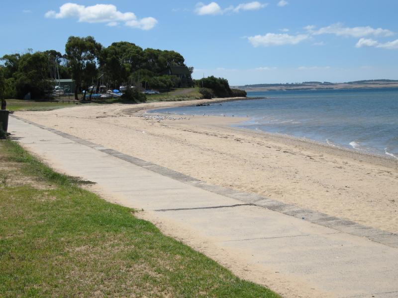 Rhyll - Shops and coast along Beach Road between Reid Street and boat ramp: View north along coast towards yacht club at lady Nelson Point