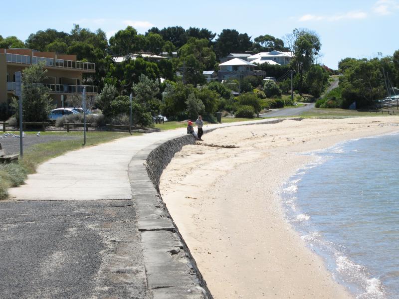 Rhyll - Shops and coast along Beach Road between Reid Street and boat ramp: View north along coast towards Lock Rd