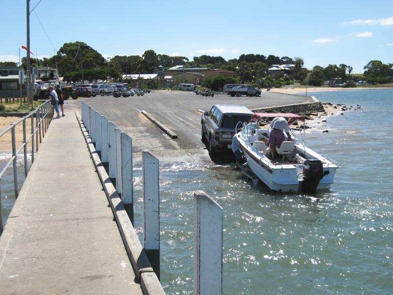 Rhyll - Boat ramp, Rhyll Jetty and coast along southern section of Beach Road: View from jetty at boat ramp towards car park