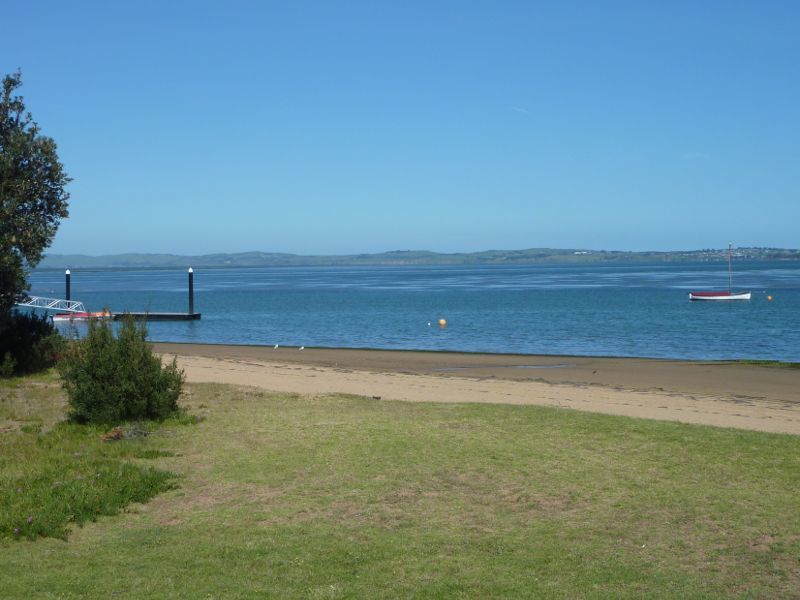 Rhyll - Boat ramp, Rhyll Jetty and coast along southern section of Beach Road: View across bay from beach between boat ramp and Rhyll Jetty