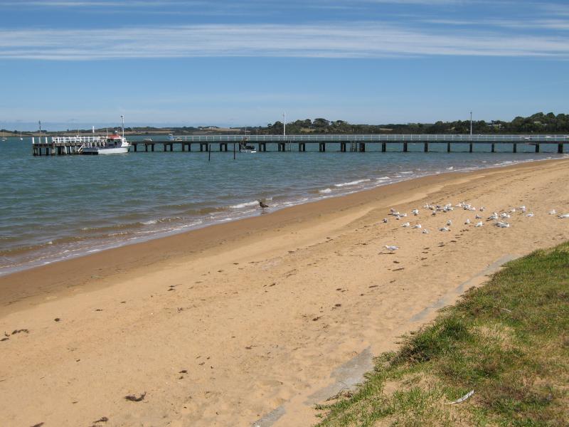 Rhyll - Boat ramp, Rhyll Jetty and coast along southern section of Beach Road - View west along coast towards Rhyll Jetty