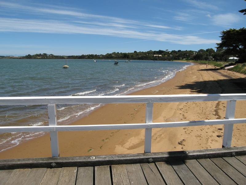 Rhyll - Boat ramp, Rhyll Jetty and coast along southern section of Beach Road - View west along beach from Rhyll Jetty