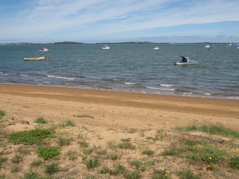 Rhyll - Boat ramp, Rhyll Jetty and coast along southern section of Beach Road: View from beach across bay from near Jansson Rd