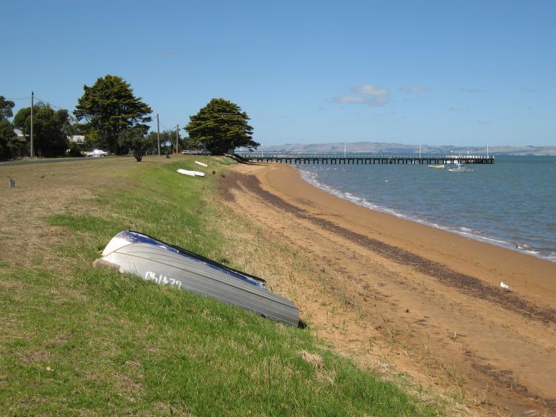 Rhyll - Boat ramp, Rhyll Jetty and coast along southern section of Beach Road: View east along beach from near Walton St