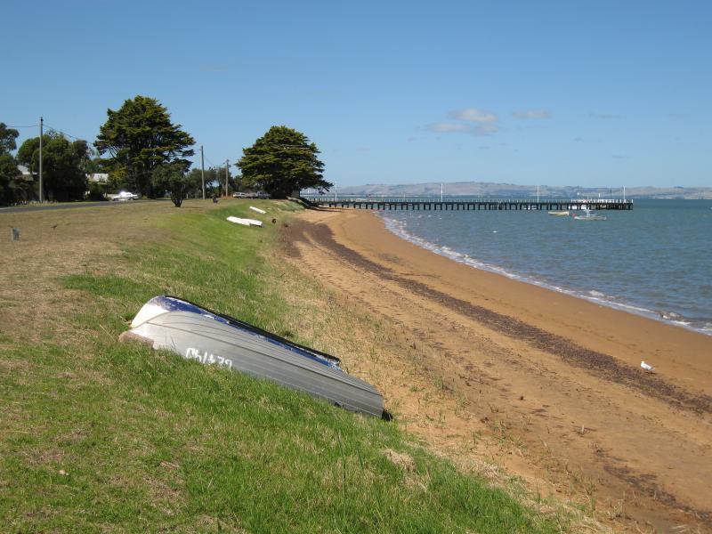 Rhyll - Boat ramp, Rhyll Jetty and coast along southern section of Beach Road - View east along beach from near Walton St