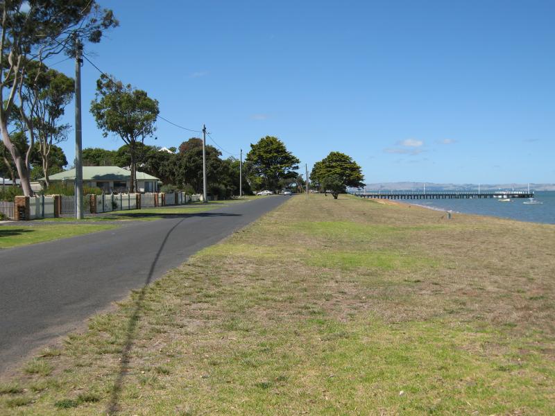 Rhyll - Boat ramp, Rhyll Jetty and coast along southern section of Beach Road - View east along Beach Rd and foreshore from near Walton St