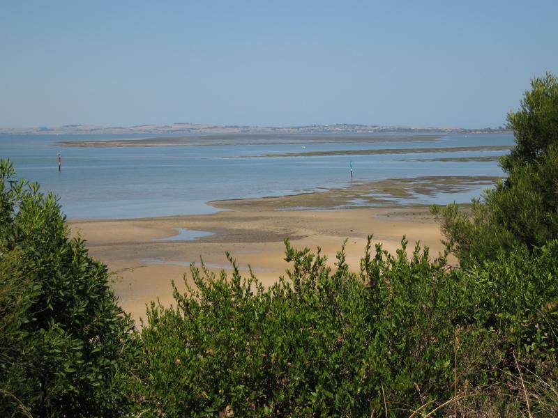 Rhyll - Lady Nelson Point, parkland at the northern end of Beach Rd: View south-east across bay at low tide with exposed mudflats
