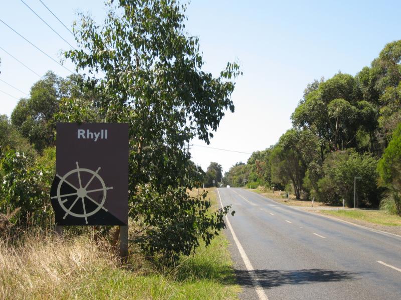 Rhyll - Around Rhyll: Rhyll town sign, view north-east along Rhyll-Newhaven Rd