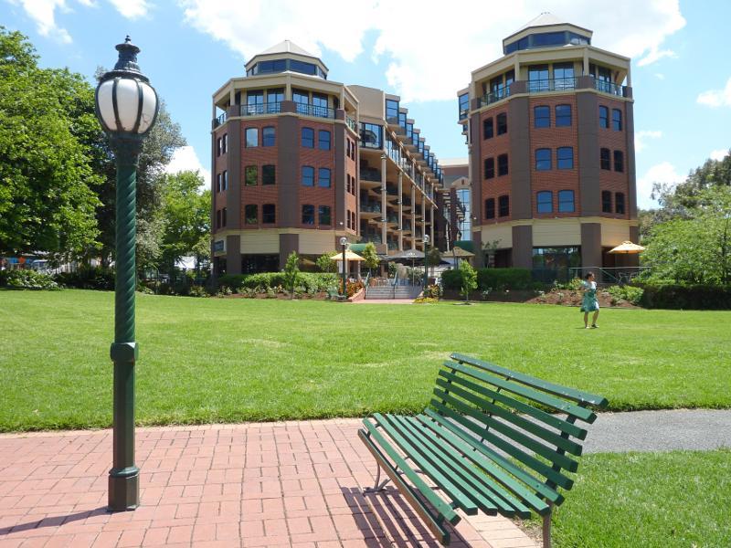Richmond - O'Connell Reserve, Bridge Road: View west through park towards Amora Hotel
