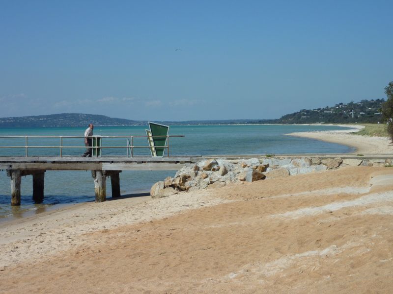 Rosebud - Foreshore reserve and Bay Trail on west side of Rosebud Pier: View east along beach towards entrance of pier