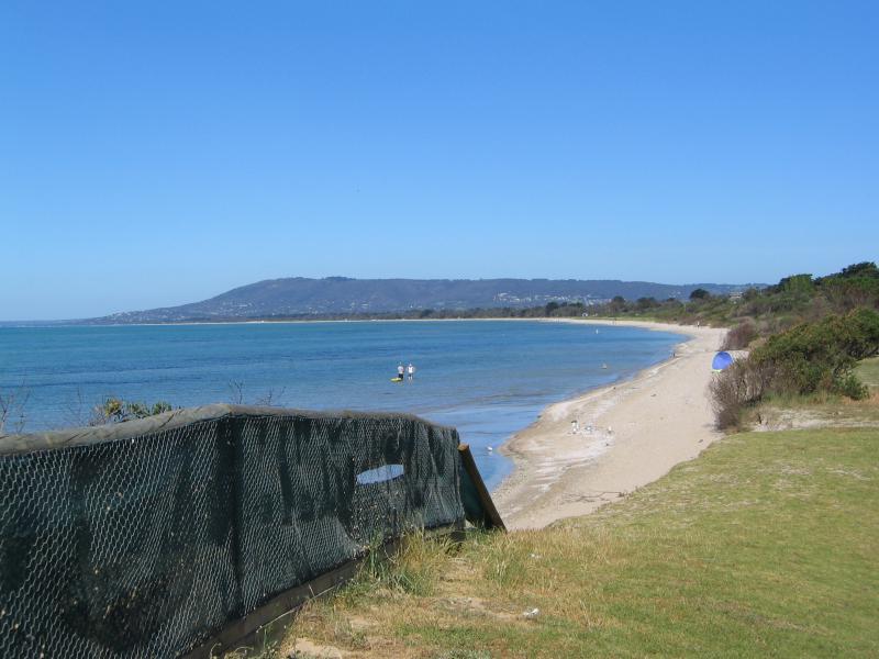 Rye - Beach on east side of Rye Pier: View east along coast opposite Lyons St with Arthurs Seat in the distance