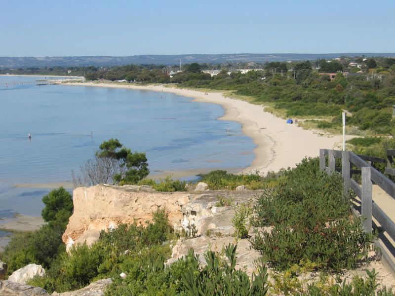 Rye - White Cliffs: View east along beach and inland from cliffs
