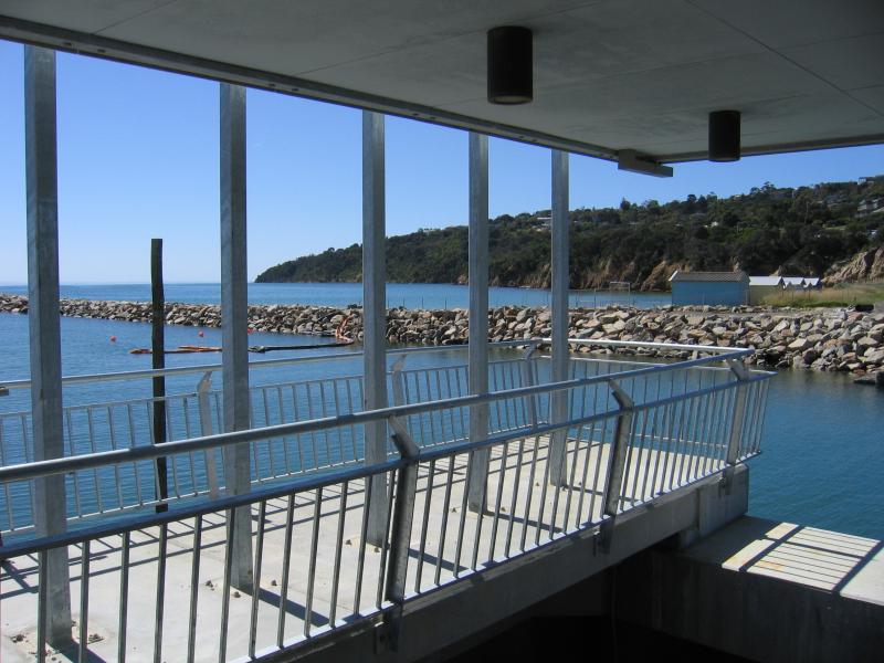 Safety Beach - Martha Cove canal entrance on coast and Marine Drive tunnel: View north across canal towards Mt Martha