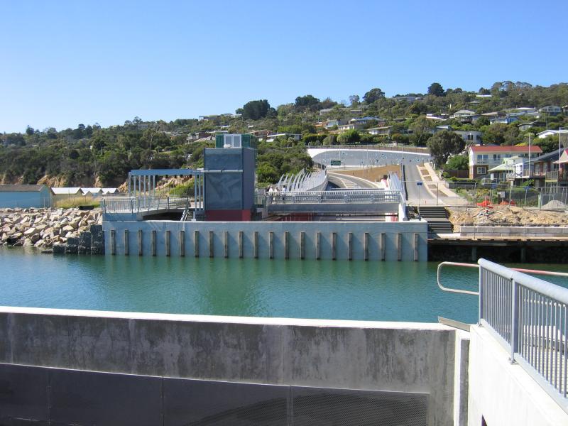Safety Beach - Martha Cove canal entrance on coast and Marine Drive tunnel: View north across canal over Marine Dr
