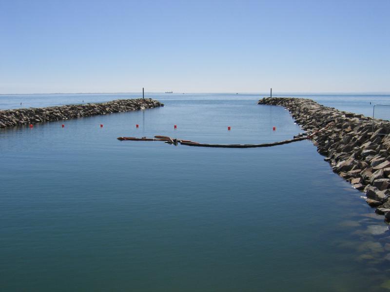 Safety Beach - Martha Cove canal entrance on coast and Marine Drive tunnel: View west along canal out to the bay