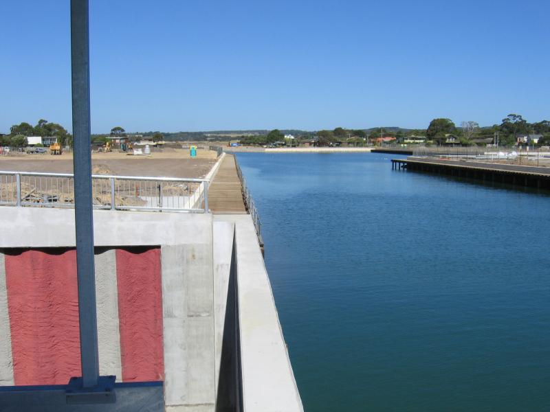 Safety Beach - Martha Cove canal entrance on coast and Marine Drive tunnel: View east along canal towards Martha Cove Development (under construction)