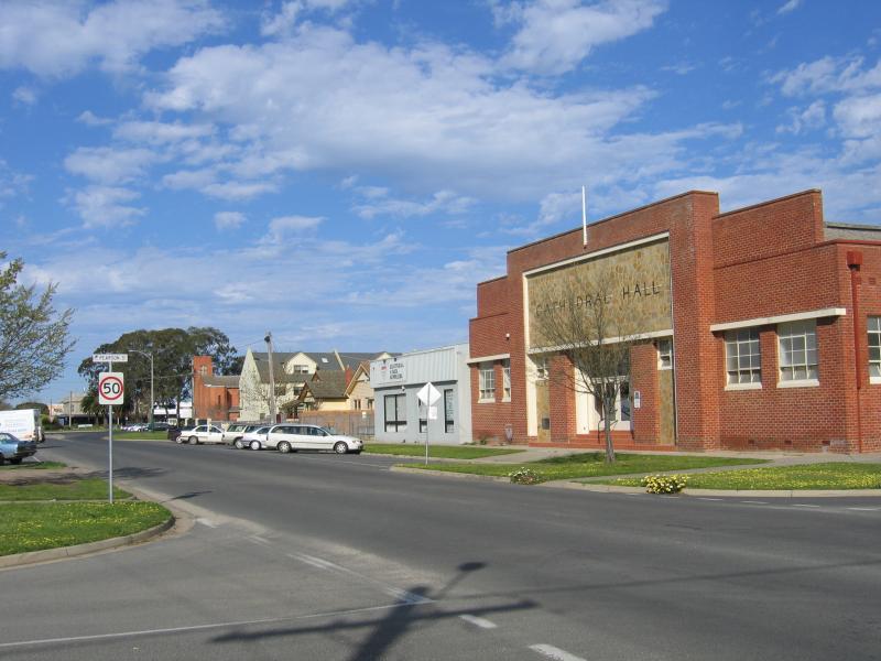 Scenic town landscape with mountains and natural beauty surrounding historic structures