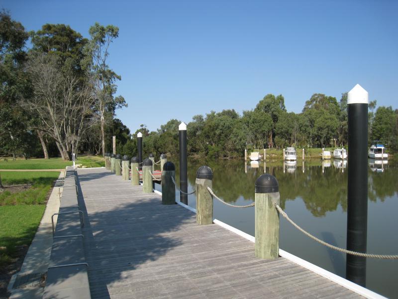Sale - Port of Sale precinct, Canal Road and McMillan Street along Flooding Creek: View south-east along canal towards end of wharf at park along McMillan St