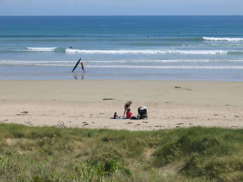 Sandy Point - Foreshore Reserve and beach at Surfers Walk: People on the beach, viewed from foreshore