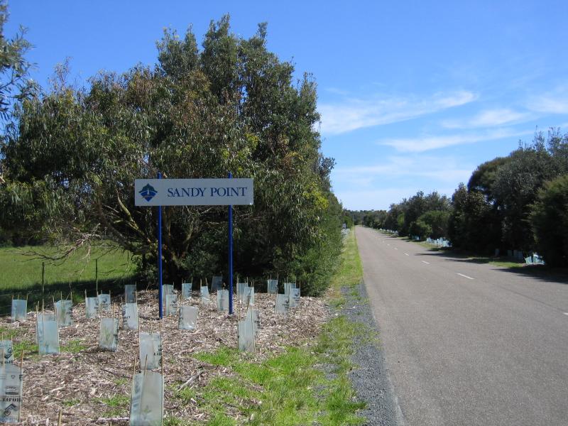 Sandy Point - Outskirts of Sandy Point: Sandy Point town sign, view south along Telopia Dr at Waratah Rd