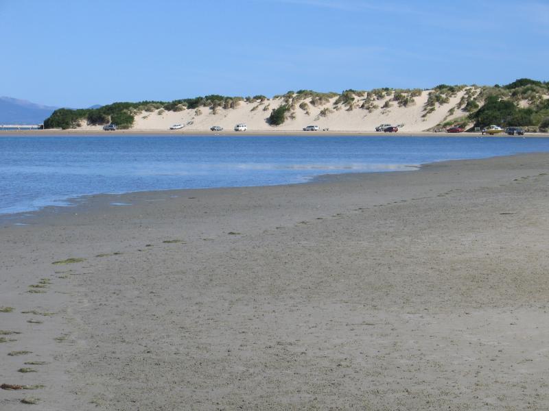 Sandy Point - Shallow Inlet at eastern end of Sandy Point Road: View south-east along coast where the road meets the beach