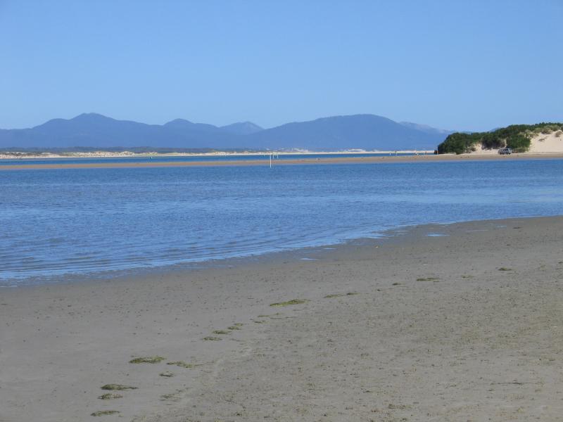 Sandy Point - Shallow Inlet at eastern end of Sandy Point Road: View south-east along coast where the road meets the beach