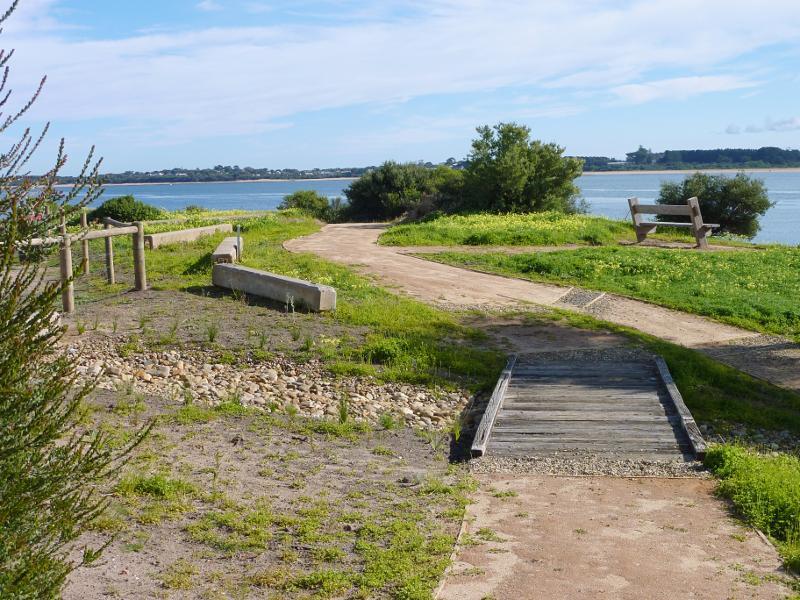 San Remo - Walking track along coast from San Remo Jetty to Back Beach: View towards beach from path at Davis Point