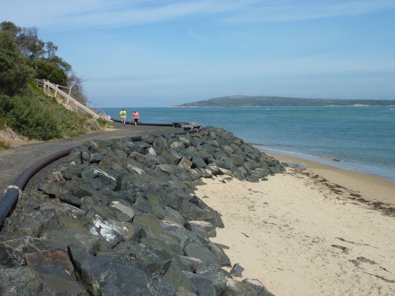 San Remo - Walking track along coast from San Remo Jetty to Back Beach: View south along beach and path towards Cape Woolamai