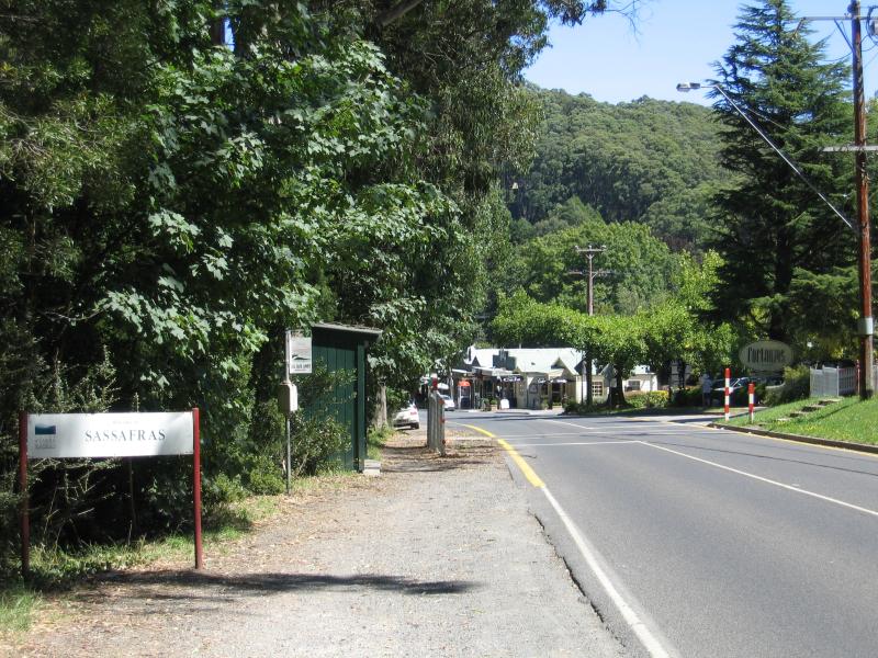 Sassafras - Commercial centre and shops, Mount Dandenong Tourist Road: Sassafras town sign, view south along Mt Dandenong Tourist Rd at primary school