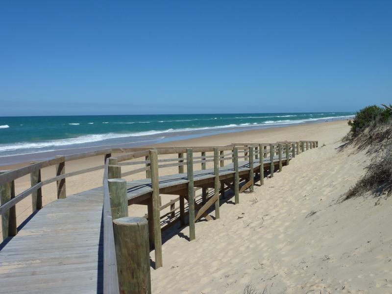 Seaspray - Beach at Seaspray Surf Life Saving Club, off Foreshore Road: South-westerly view along beach from walkway