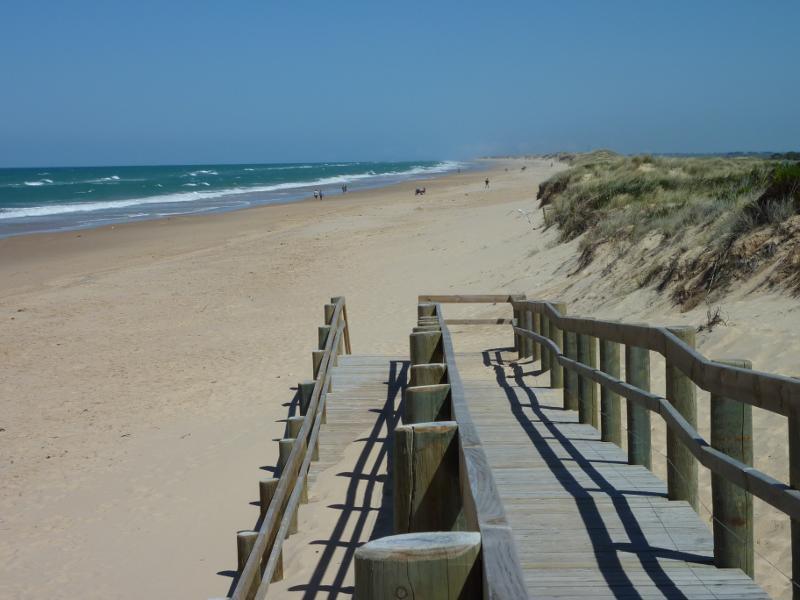 Seaspray - Beach at Seaspray Surf Life Saving Club, off Foreshore Road: South-westerly view along beach from walkway
