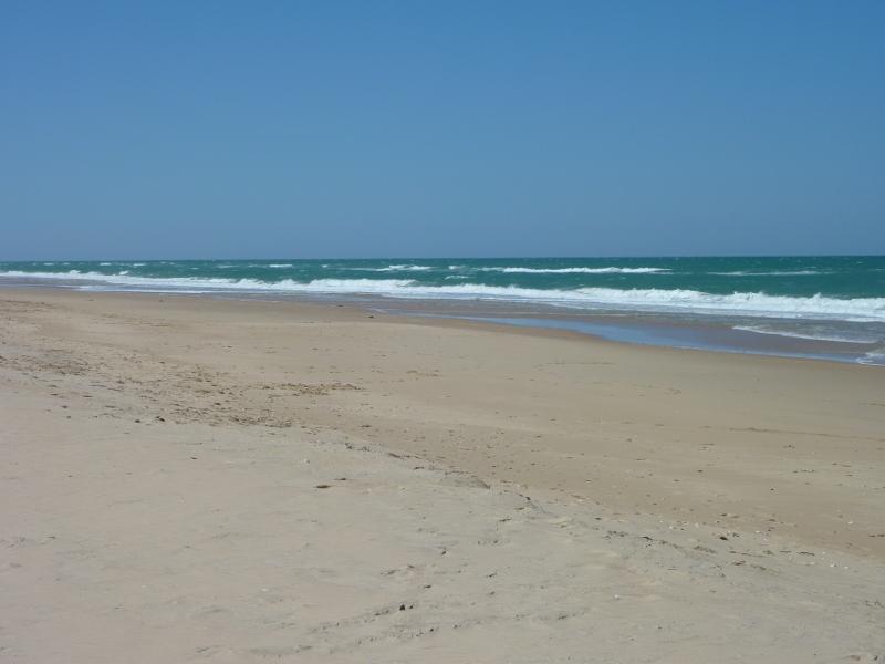 Seaspray - Beach at south-western end of Foreshore Road and mouth of Merriman Creek: View east across beach