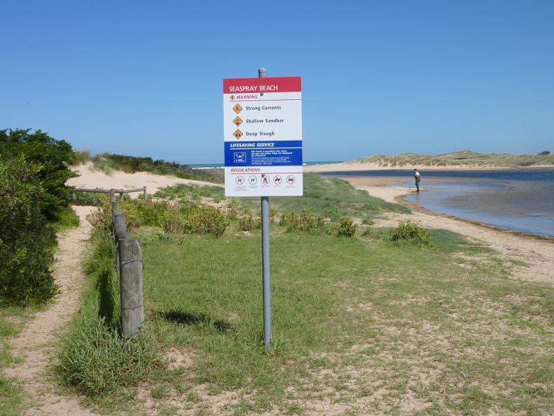 Seaspray - Merriman Creek and fishing platform at the park at end of Foreshore Road: View south along creek towards beach
