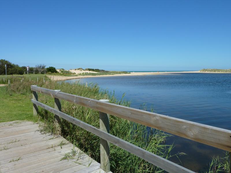 Seaspray - Merriman Creek and fishing platform at the park at end of Foreshore Road: Southerly view along creek from fishing platform