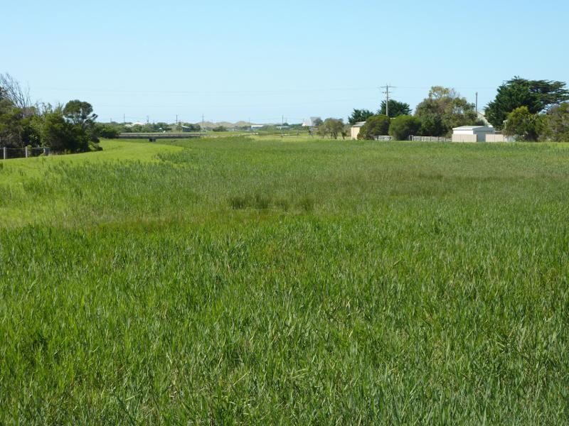 Seaspray - Reserve north of Buckley Street, along Merriman Creek and The Island: View north-east along floodway near Merriman Creek towards bridge at Futcher St