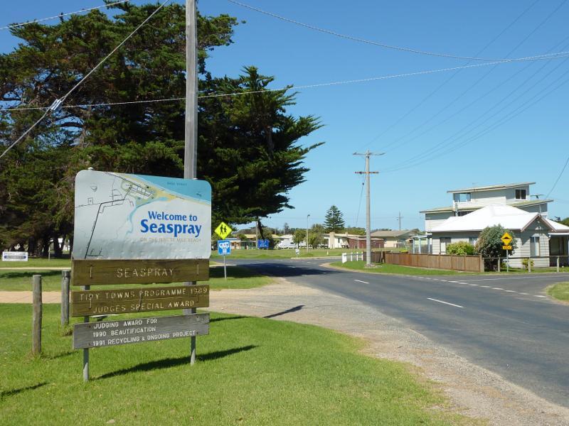 Seaspray - Around Seaspray: Welcome to Seaspray sign, view south-east along Futcher St towards Buckley St