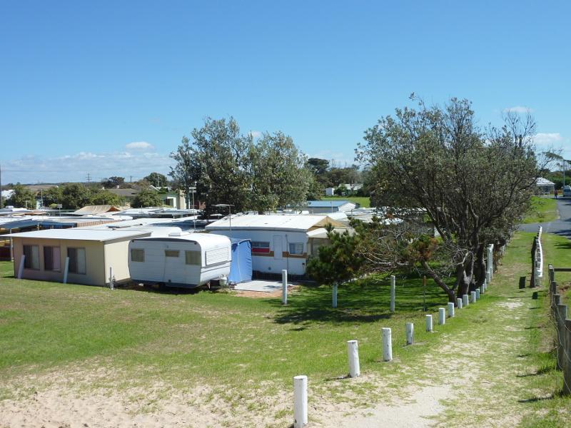 Seaspray - Beach at south-east end of Futcher Street: North-west view over Seaspray Caravan Park from path at top of sand dunes