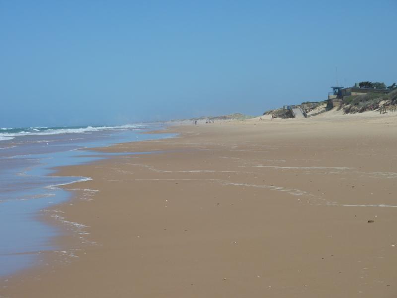 Seaspray - Beach at south-east end of Futcher Street: View south-west along beach towards Seaspray Surf Life Saving Club