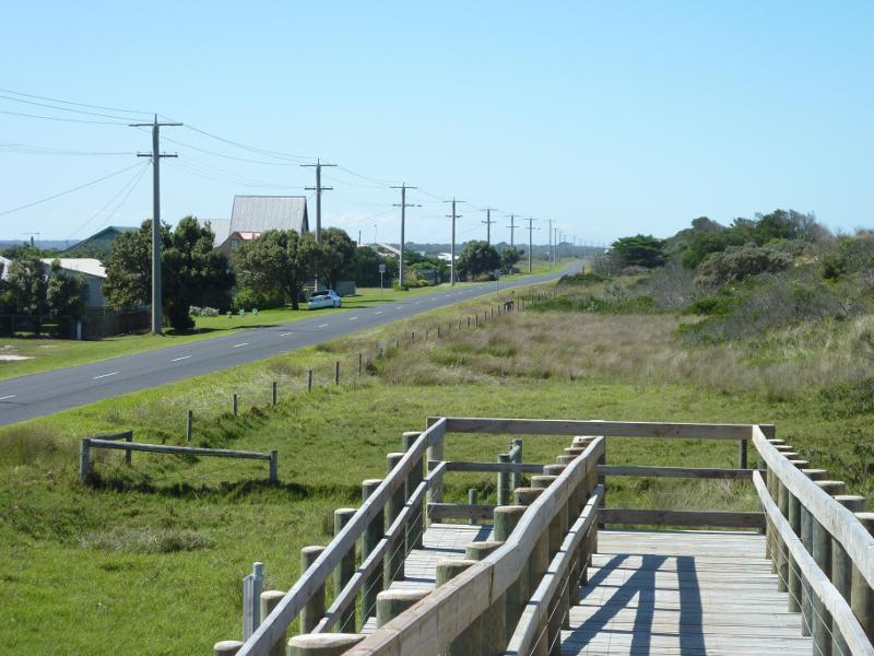 Seaspray - Beach at Shoreline Drive opposite Centre Road: View north-east along Shoreline Dr from steps over sand dunes