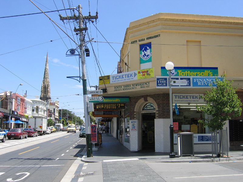 South Yarra - Shops along Toorak Road: South Yarra Newsagency, view west along Toorak Rd at Caroline St