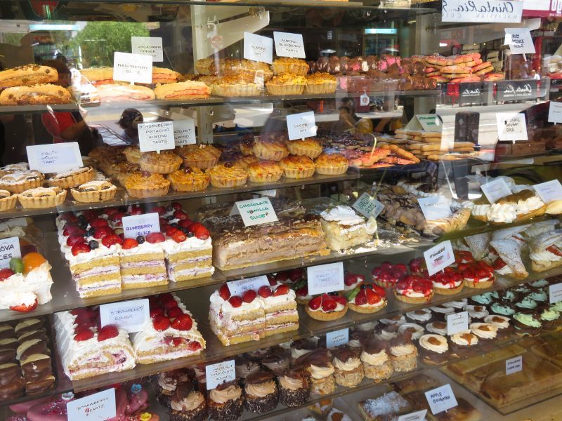 St Kilda - Acland Street shops: Display window of Le Bon Cakes opposite Irwell St