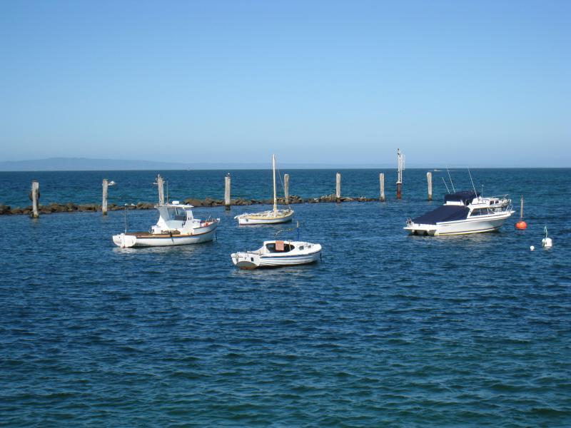 St Leonards - St Leonards Pier, eastern end of Murradoc Road: Boats moored near rocks at far arm of pier