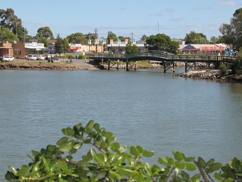 Tooradin - Sawtells Inlet along Tooradin Station Road: View south-east along Sawtells Inlet towards footbridge from south of Evans St