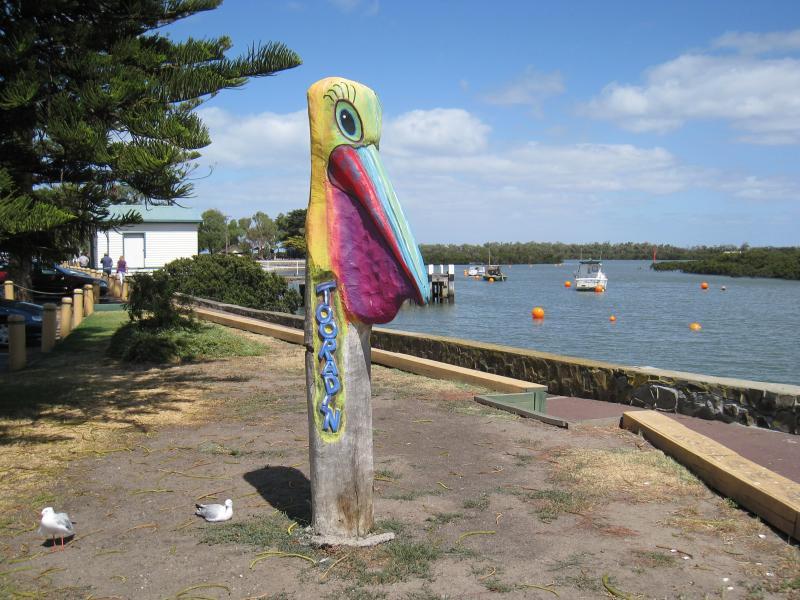 Tooradin - Sawtells Inlet and jetty, Foreshore Road: Pelican wood carving, Foreshore Rd north of jetty