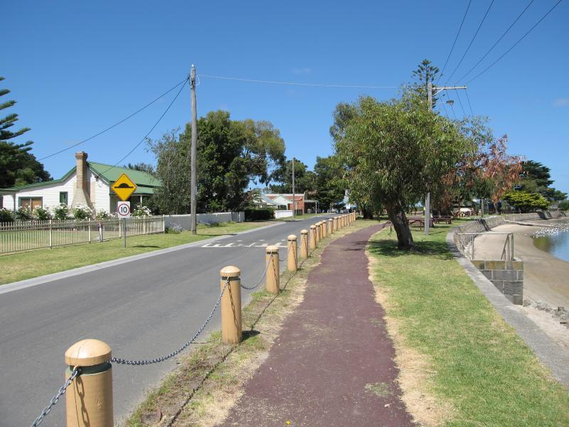 Tooradin - Sawtells Inlet and jetty, Foreshore Road: View south-west along Foreshore Rd, south of jetty