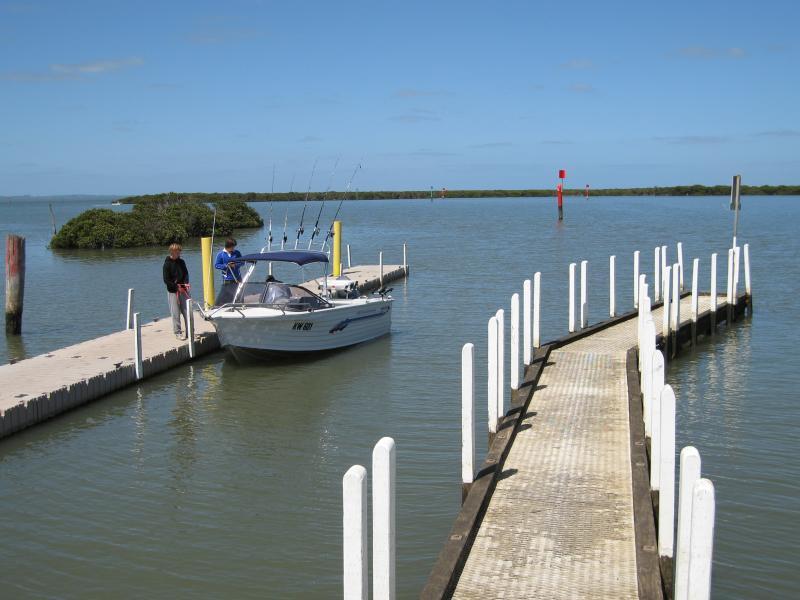 Tooradin - Boat ramp and surroundings, Sawtells Inlet south of Foreshore Road: Boat moored at boat ramp