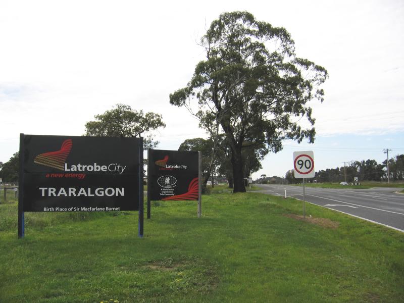 Traralgon - Around town: Welcome to Traralgon sign, view east along Princes Hwy towards Bradford Rd